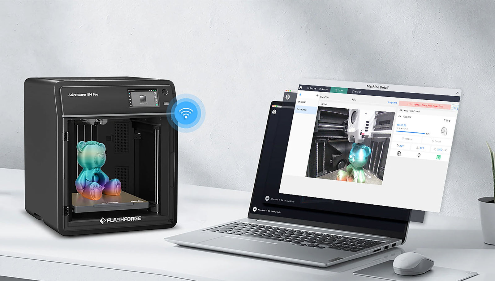 3D printer and laptop on a desk with a computer screen displaying Flashforge Orca Slicer 3D model design software.